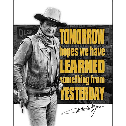 Black and white photo of a person in cowboy attire with a motivational quote in yellow text on a dark background.