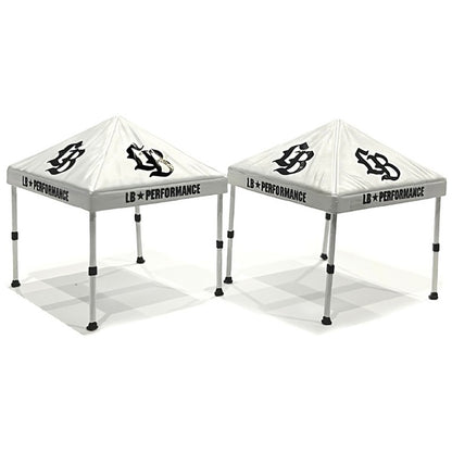 Two white tents with 'LB Performance' branding on a white background