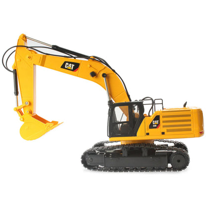 Model of a Radio Controlled Yellow Caterpillar 336 Excavator on a White Background