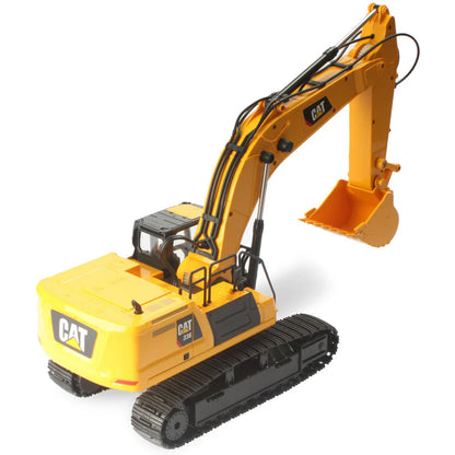 Model of a Radio Controlled Yellow Caterpillar 336 Excavator on a White Background