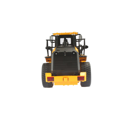 Radio controlled model of a CAT yellow & black Caterpillar 950M wheel loader on a white background