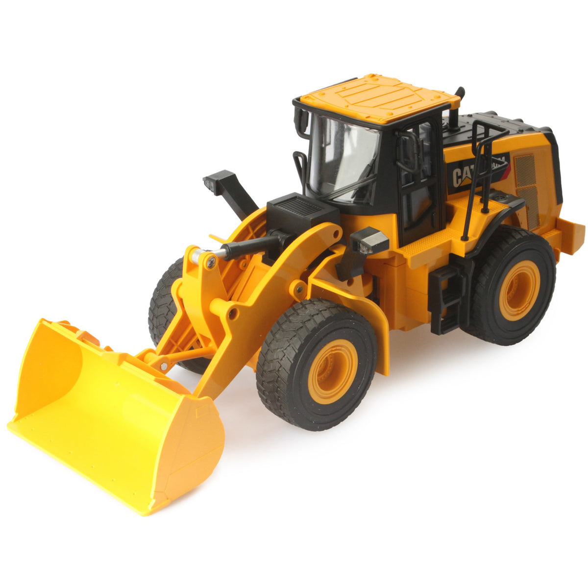 Radio controlled model of a CAT yellow & black Caterpillar 950M wheel loader on a white background