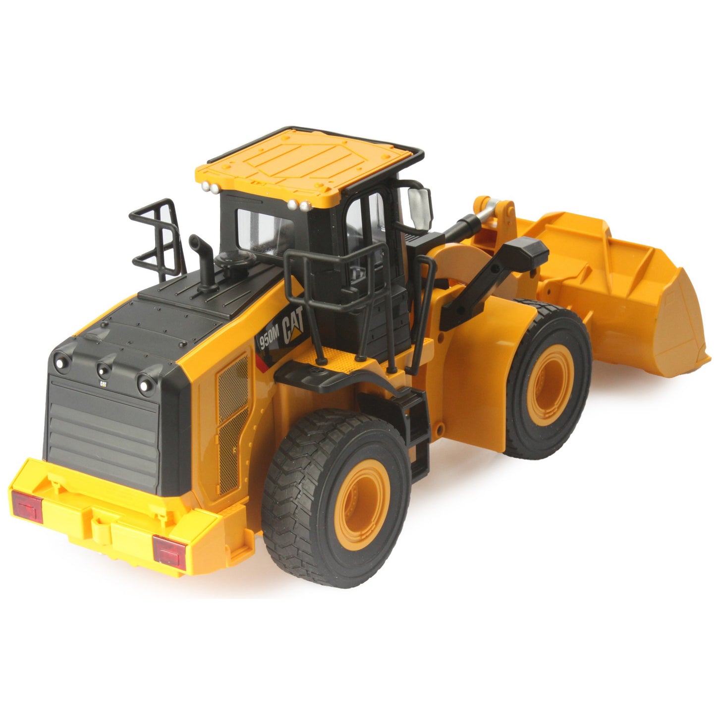 Radio controlled model of a CAT yellow & black Caterpillar 950M wheel loader on a white background