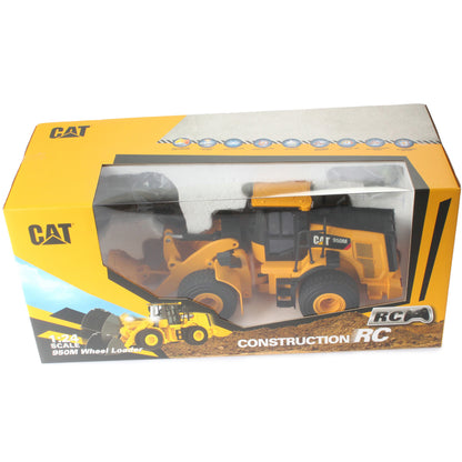 CAT brand construction RC wheel loader toy in its original yellow and gray retail packaging, showing the yellow die-cast model vehicle through a clear plastic window.