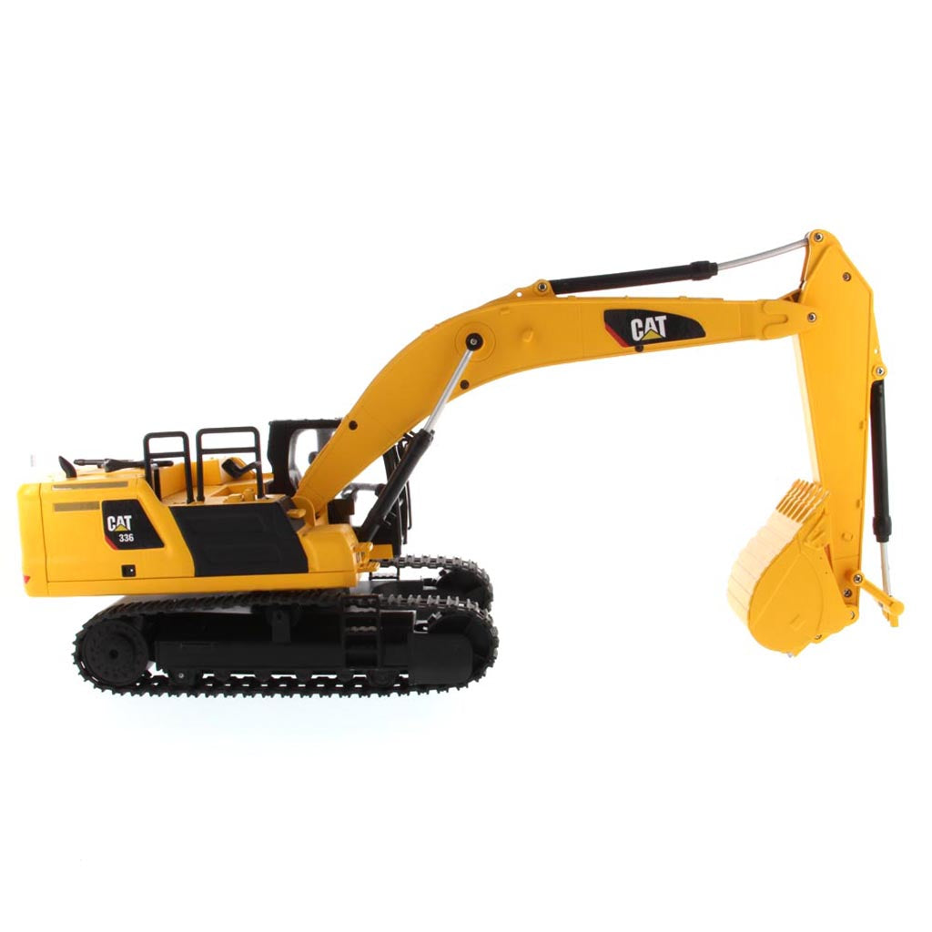 Yellow and Black Remote Controlled Toy Caterpillar 336 Excavator on a White Background