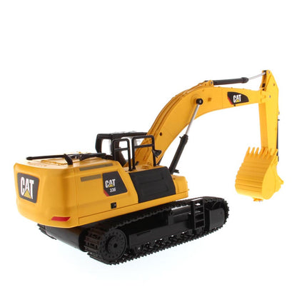 Yellow and Black Remote Controlled Toy Caterpillar 336 Excavator on a White Background