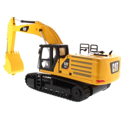 Yellow and Black Remote Controlled Toy Caterpillar 336 Excavator on a White Background