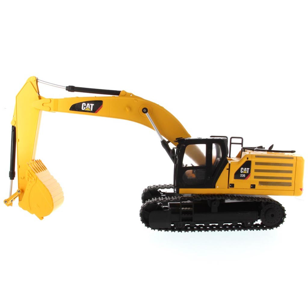 Yellow and Black Remote Controlled Toy Caterpillar 336 Excavator on a White Background