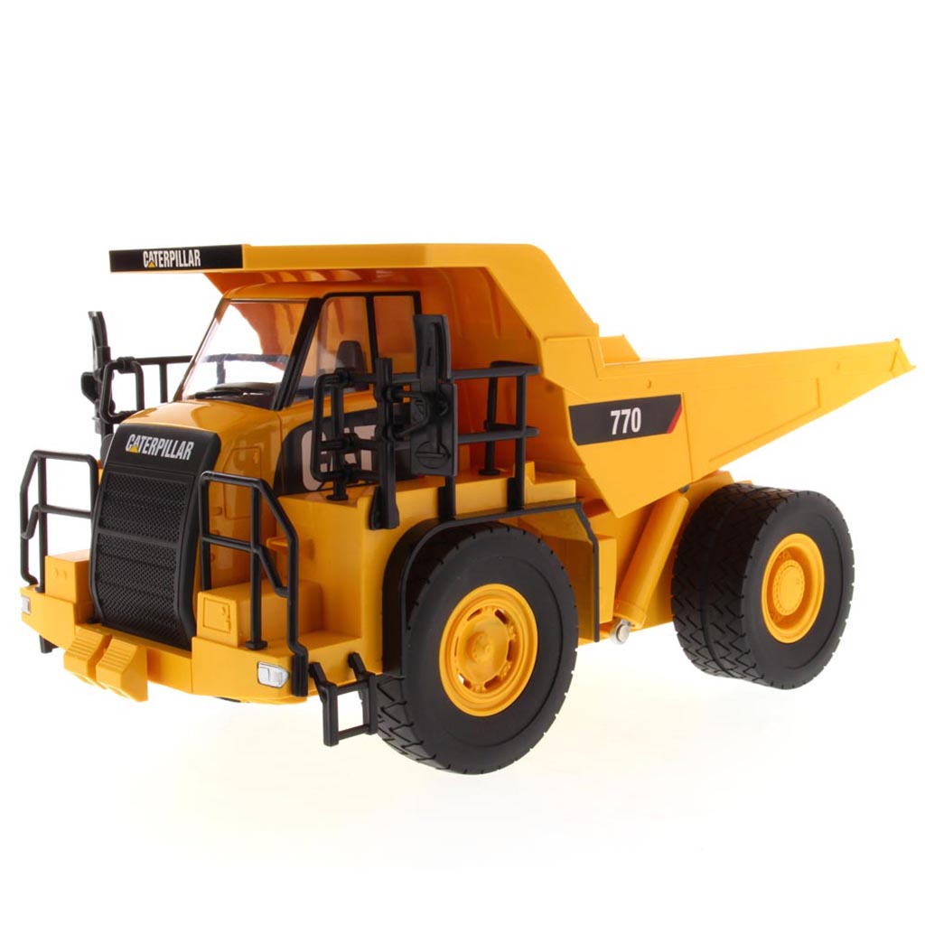 Yellow and Black Remote Controlled Model of a Caterpillar 770 Mining Dump Truck on a White Background