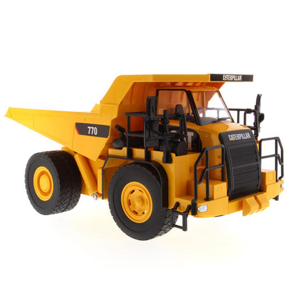 Yellow and Black Remote Controlled Model of a Caterpillar 770 Mining Dump Truck on a White Background