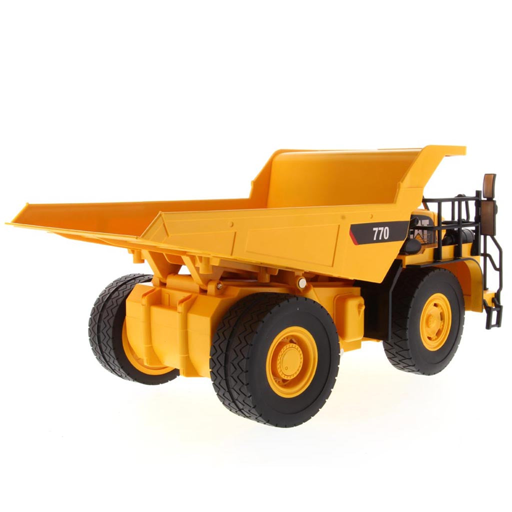 Yellow and Black Remote Controlled Model of a Caterpillar 770 Mining Dump Truck on a White Background