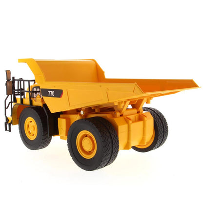 Yellow and Black Remote Controlled Model of a Caterpillar 770 Mining Dump Truck on a White Background