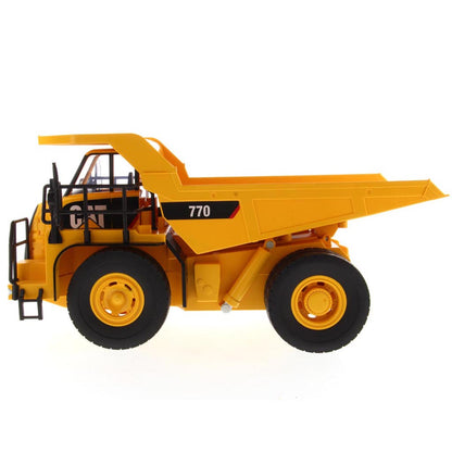 Yellow and Black Remote Controlled Model of a Caterpillar 770 Mining Dump Truck on a White Background