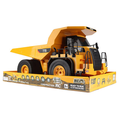 Radio Controlled Model of a CAT Yellow Caterpillar 770 Off-Highway Dump Truck in Packaging on a White Background