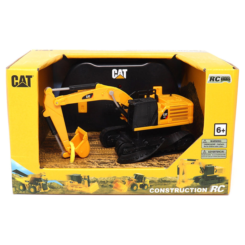 CAT brand yellow and black remote control excavator toy in its original yellow retail packaging, featuring a 6+ age rating and construction-themed graphics.