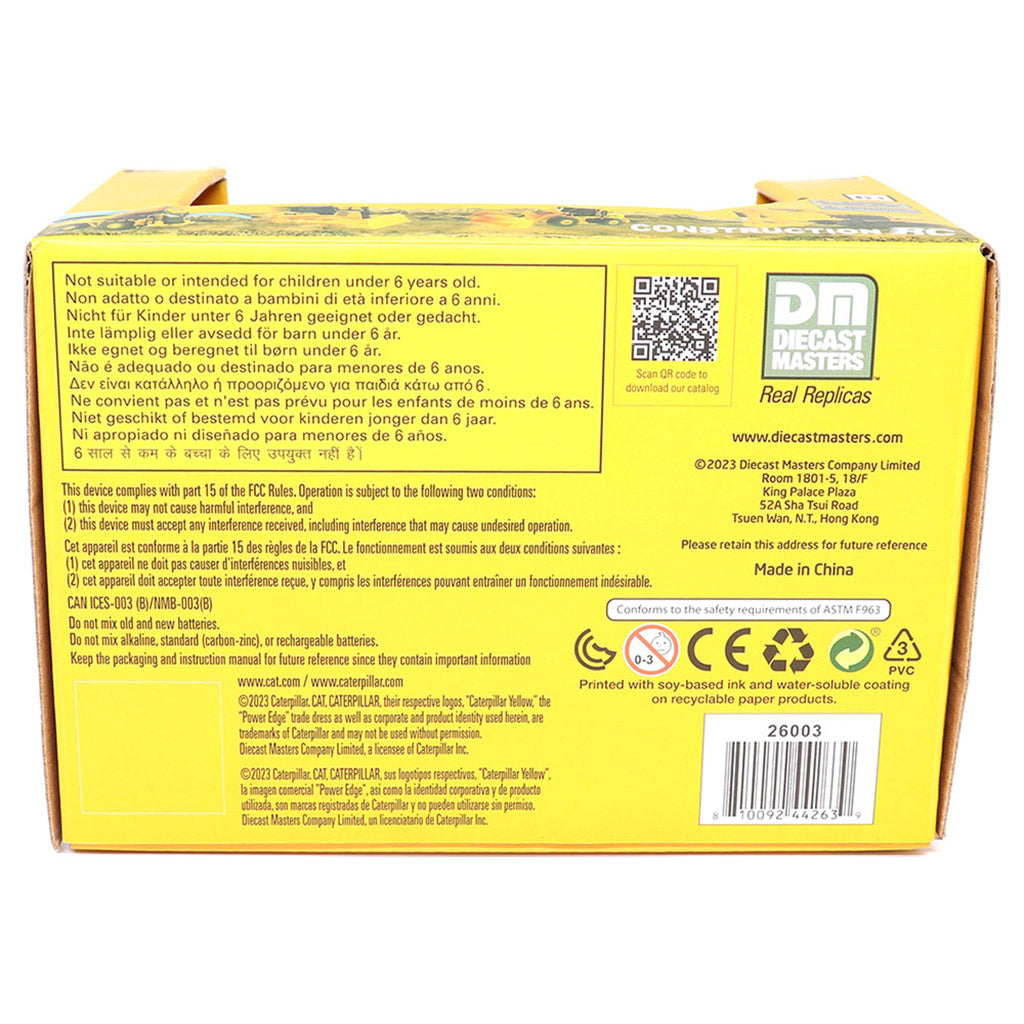 The back of a yellow box of Diecast Masters Radio Controlled Wheel Loader, showing detailed safety instructions, a QR code, and the Diecast Masters logo on a white background.