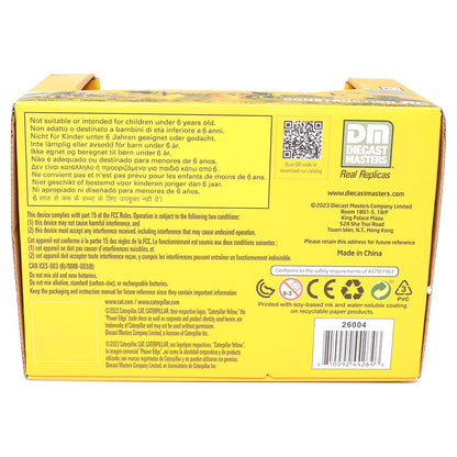 The back of a yellow box of Diecast Masters Radio Controlled Dump Truck, showing detailed safety instructions, a QR code, and the Diecast Masters logo on a white background.