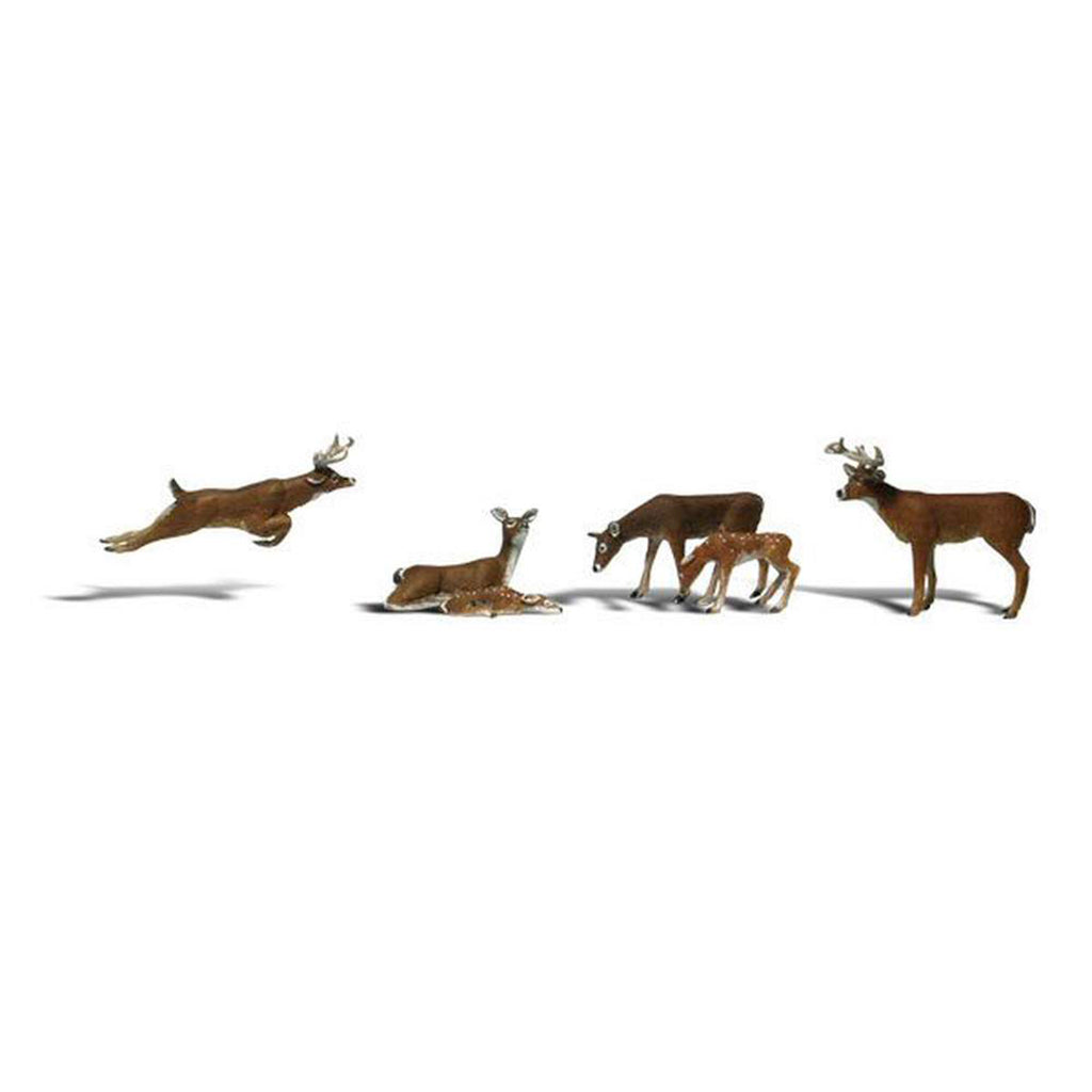 Set of deer figurines on a white background