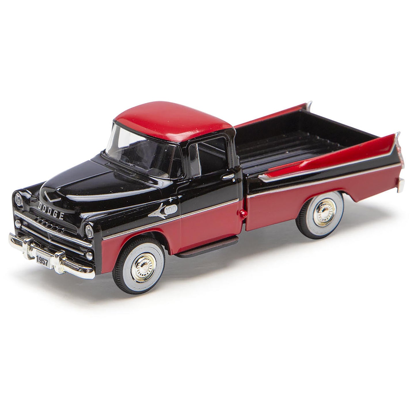 Model of a black and red Dodge truck on a white background