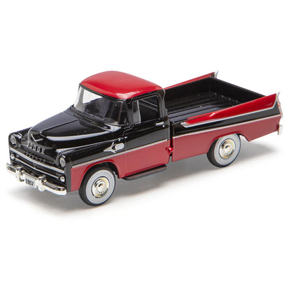 Model of a black and red Dodge truck on a white background