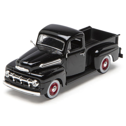 Model of a black vintage truck on a white background
