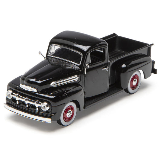 Model of a black vintage truck on a white background