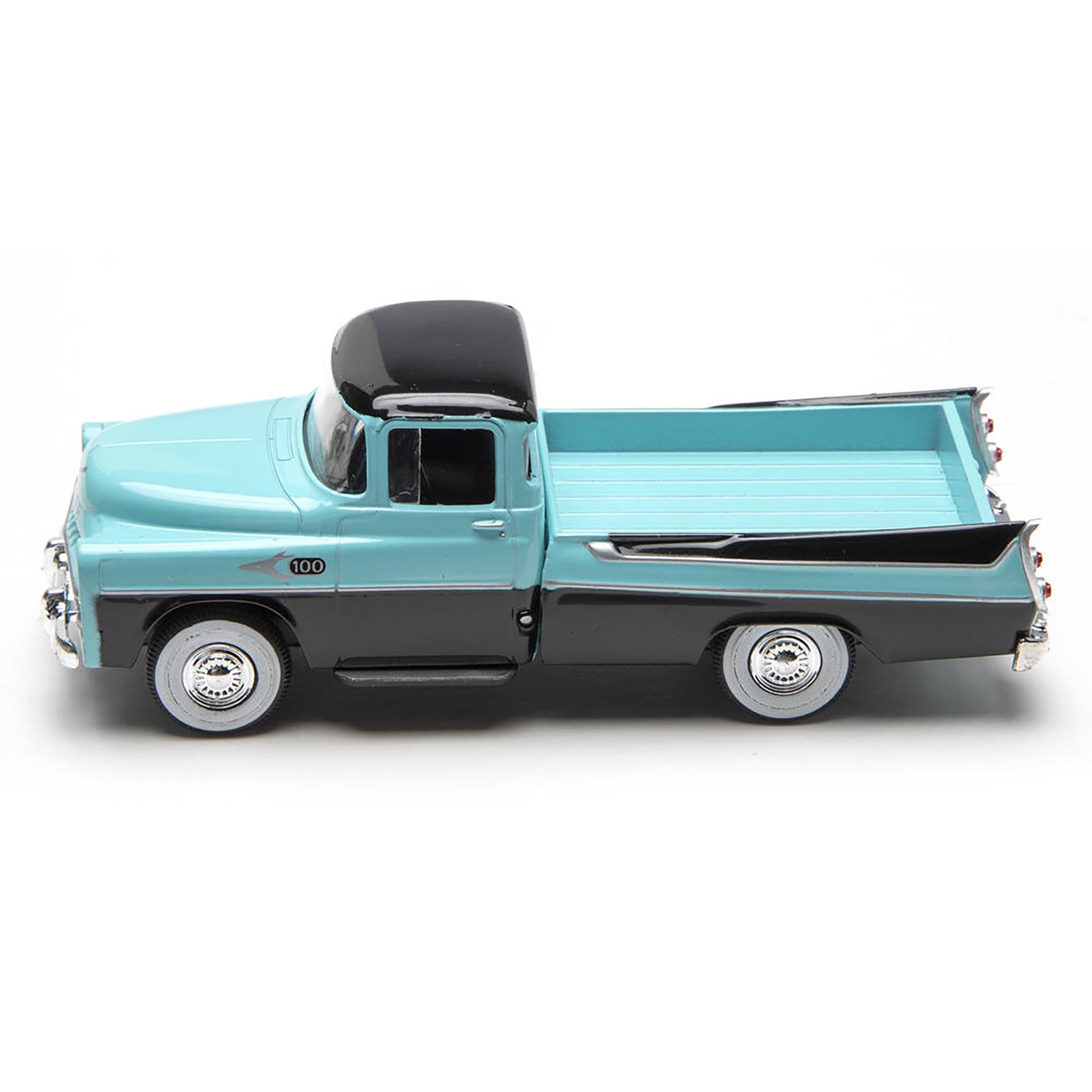 Model of a vintage truck with a light blue body and black roof on a white background