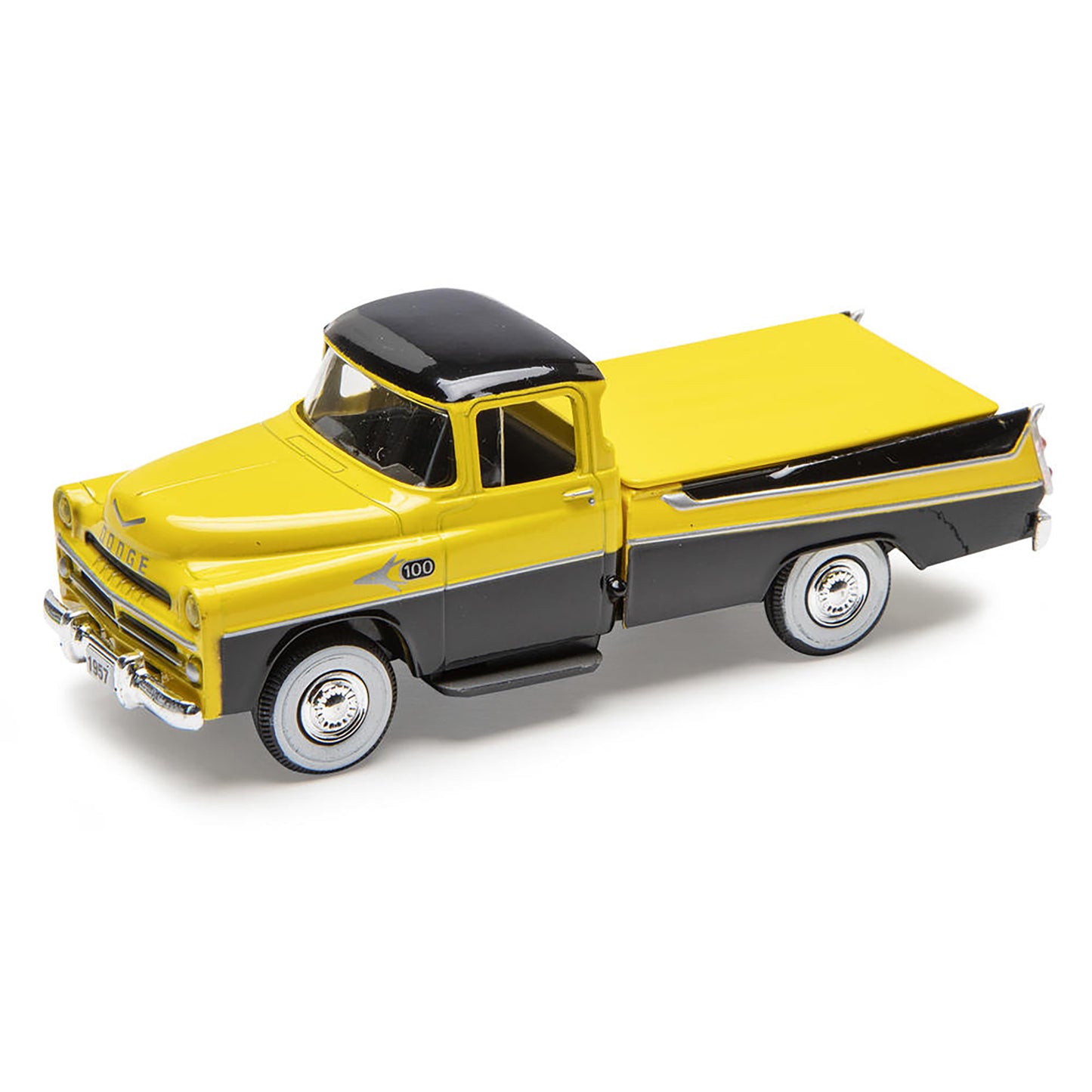 Model of a yellow and black truck on a white background