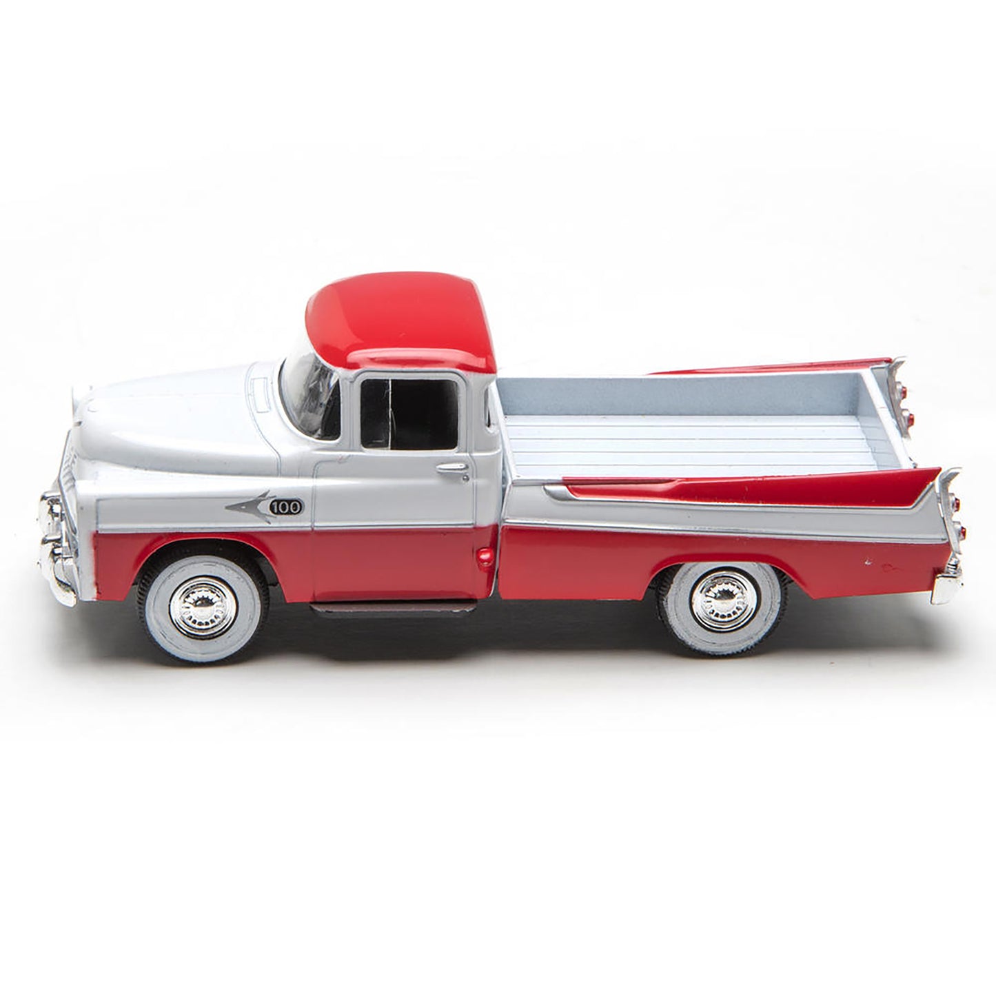 Model of a red and white pickup truck on a white background