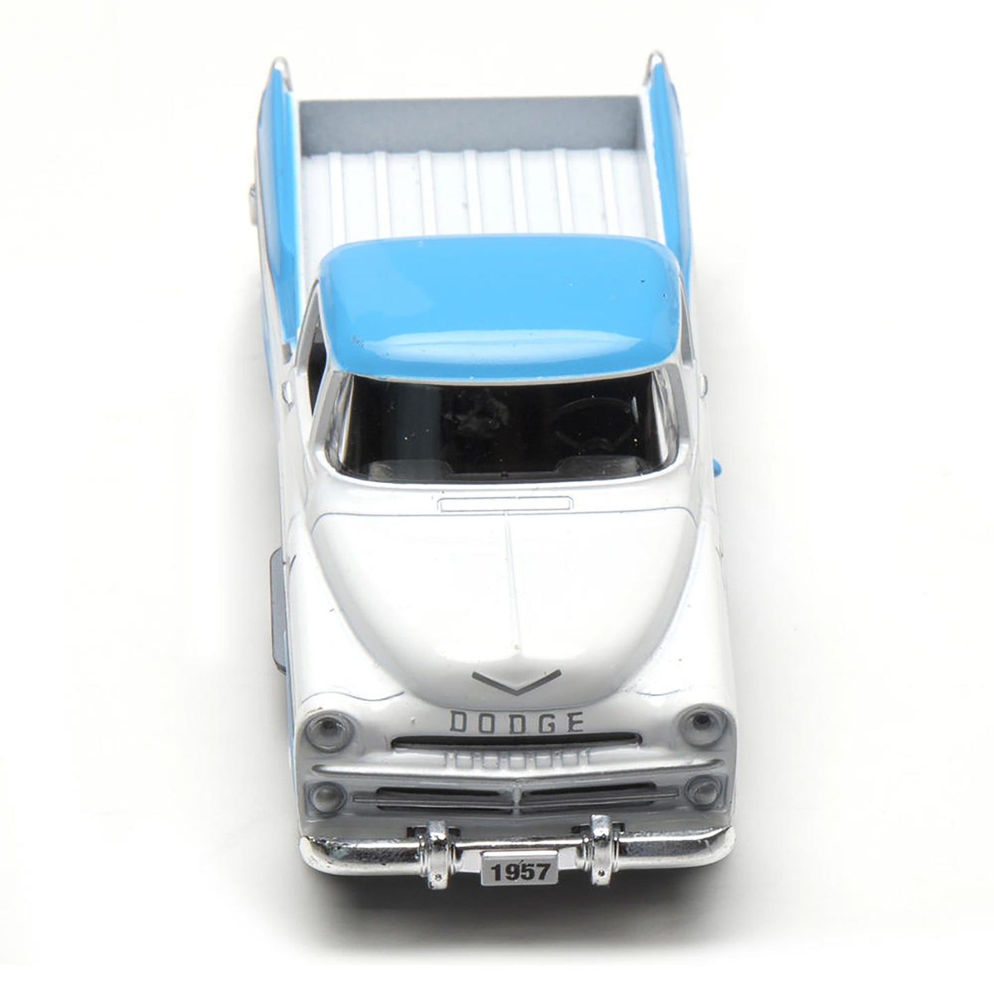 Model of a 1957 Dodge truck with an open bed on a white background