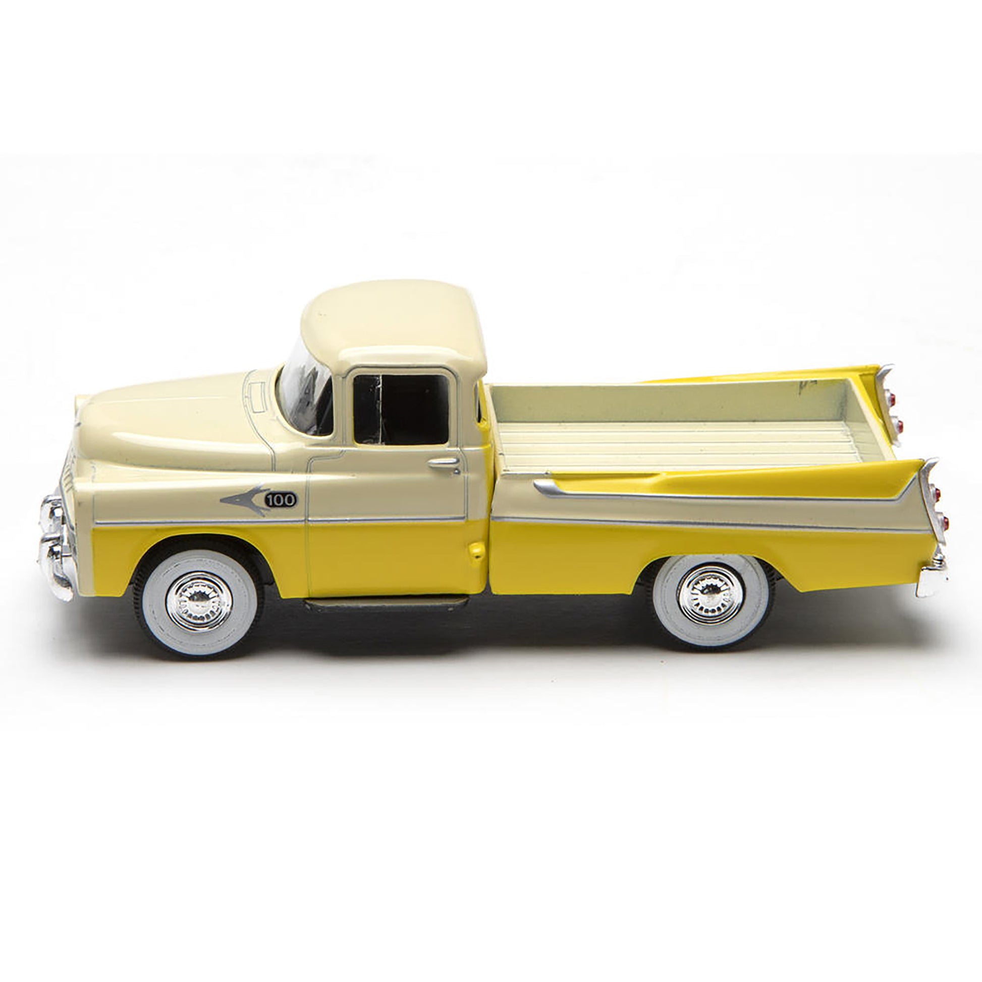 Model of a yellow and beige pickup truck on a white background