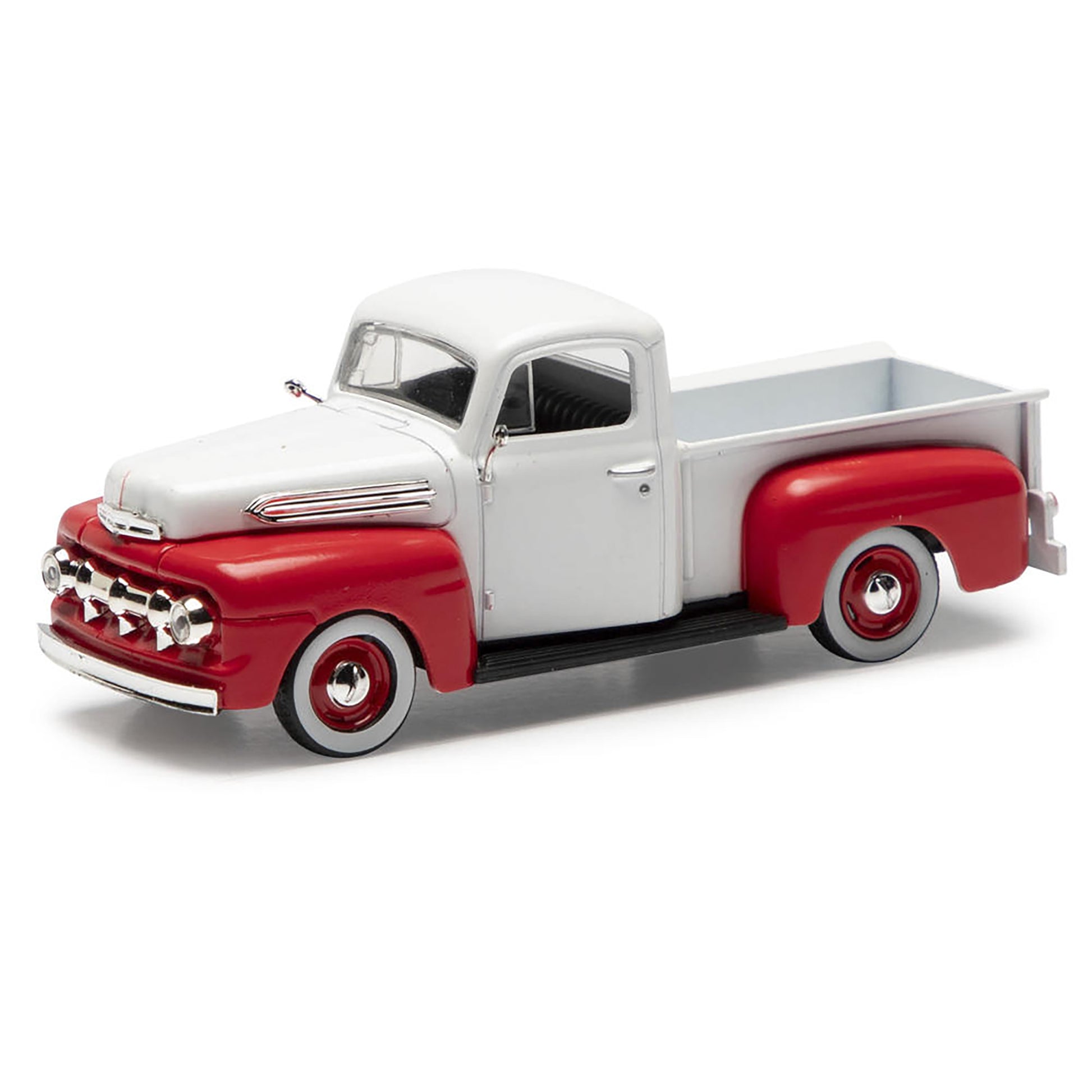 Model of a classic red and white pickup truck on a white background