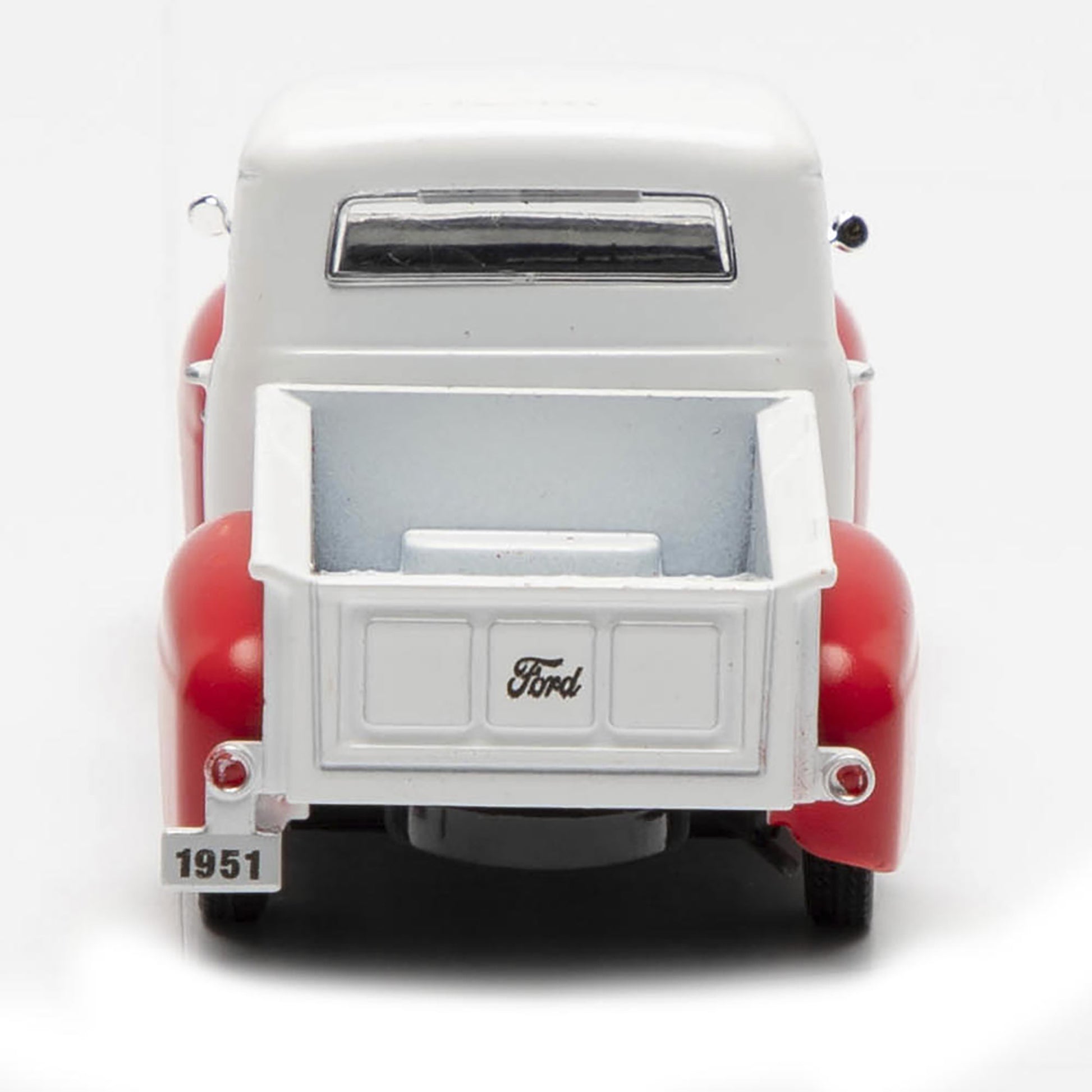 Model of a 1951 Ford truck with a white bed and red body on a white background