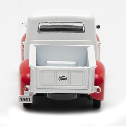 Model of a 1951 Ford truck with a white bed and red body on a white background