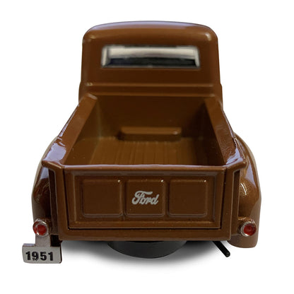 Model of a vintage brown Ford truck on a white background