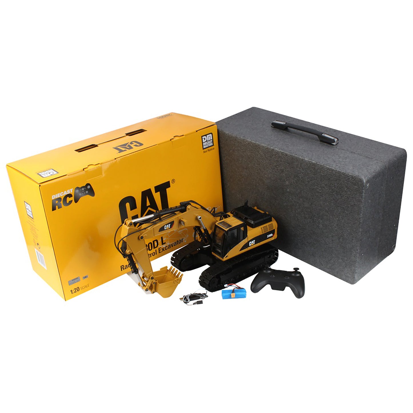 A yellow and black CAT remote control excavator toy shown with its yellow CAT retail box, a dark gray foam storage case, and a black remote controller on a white background.