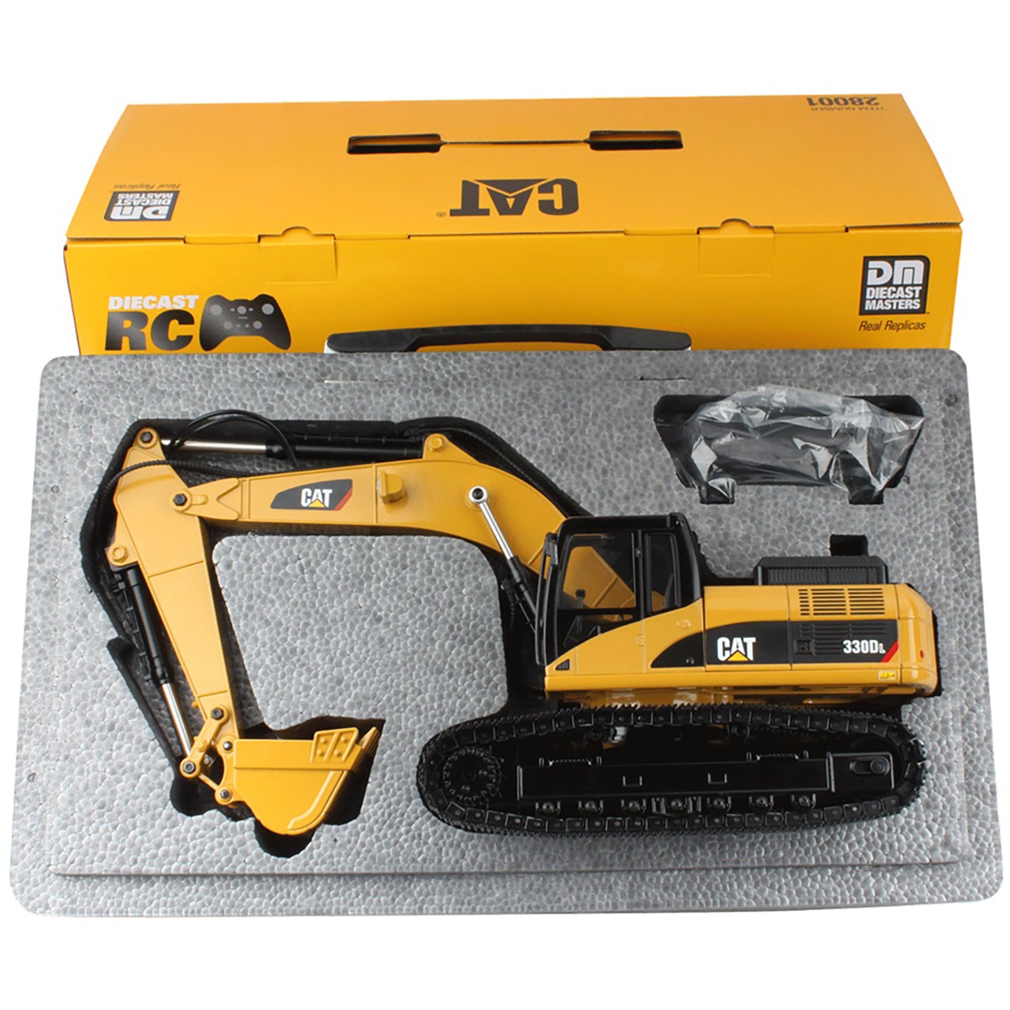 CAT 330D L diecast remote control excavator toy shown in its gray foam tray packaging, with the original yellow CAT carrying box positioned behind it on a white background.