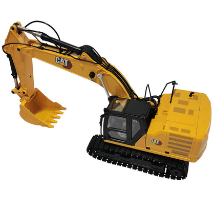 A yellow and black Remote Controlled CAT excavator toy shown on a plain white background, with the CAT logo visible on the arm.