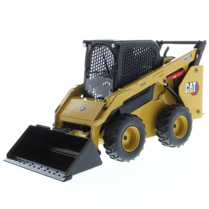 Radio Controlled Model of a CAT Yellow and Black Caterpillar 272D3 Skid Steer Loader with Standard Bucket on a White Background
