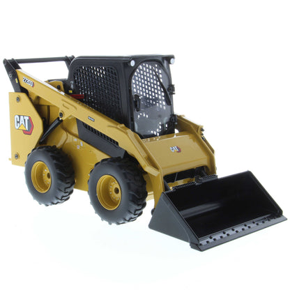 Radio Controlled Model of a CAT Yellow and Black Caterpillar 272D3 Skid Steer Loader with Standard Bucket on a White Background