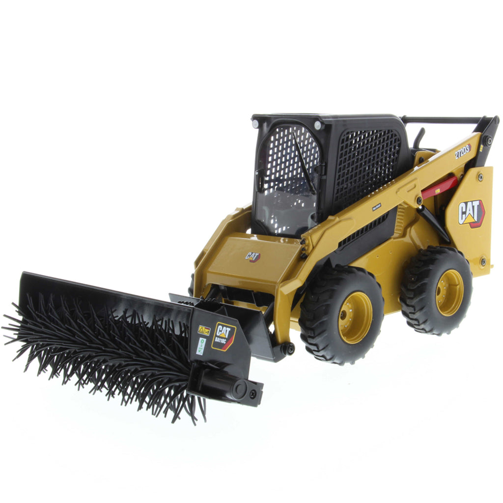 Radio Controlled Model of a CAT Yellow and Black Caterpillar 272D3 Skid Steer Loader with a Powered Brush/Broom on a White Background