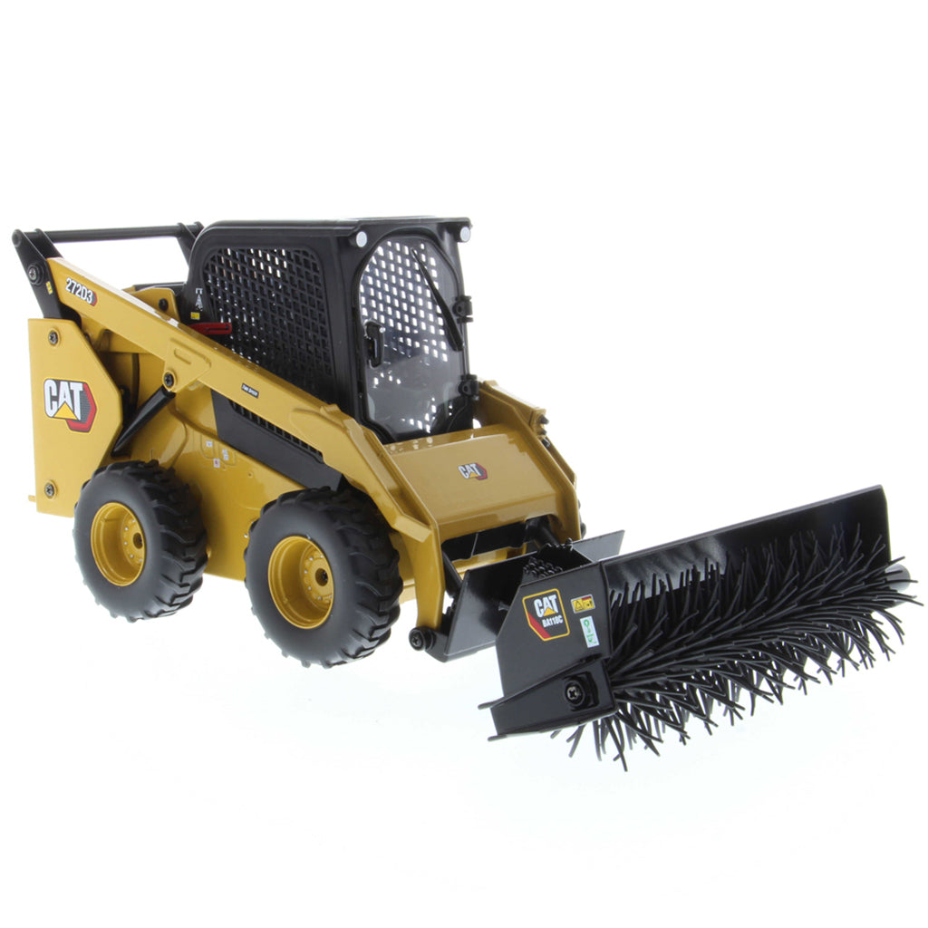 Radio Controlled Model of a CAT Yellow and Black Caterpillar 272D3 Skid Steer Loader with a Powered Brush/Broom on a White Background