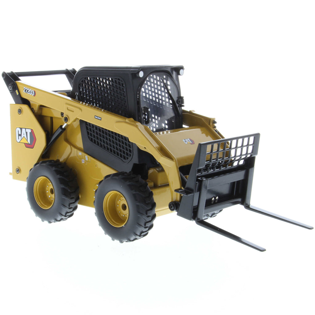 Radio Controlled Model of a CAT Yellow and Black Caterpillar 272D3 Skid Steer Loader with Pallet Forks on a White Background