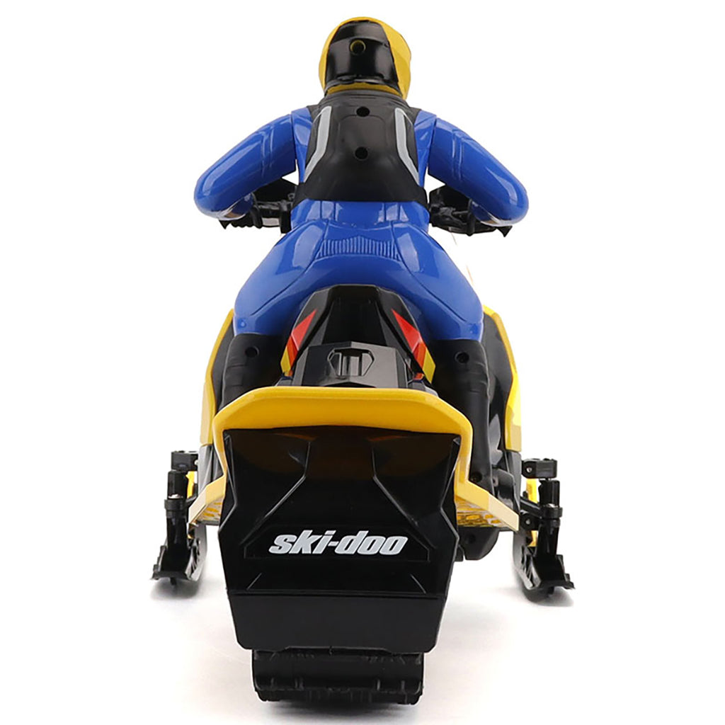 Model of a R/C Ski-Doo MXZ snowmobile with a rider on a white background