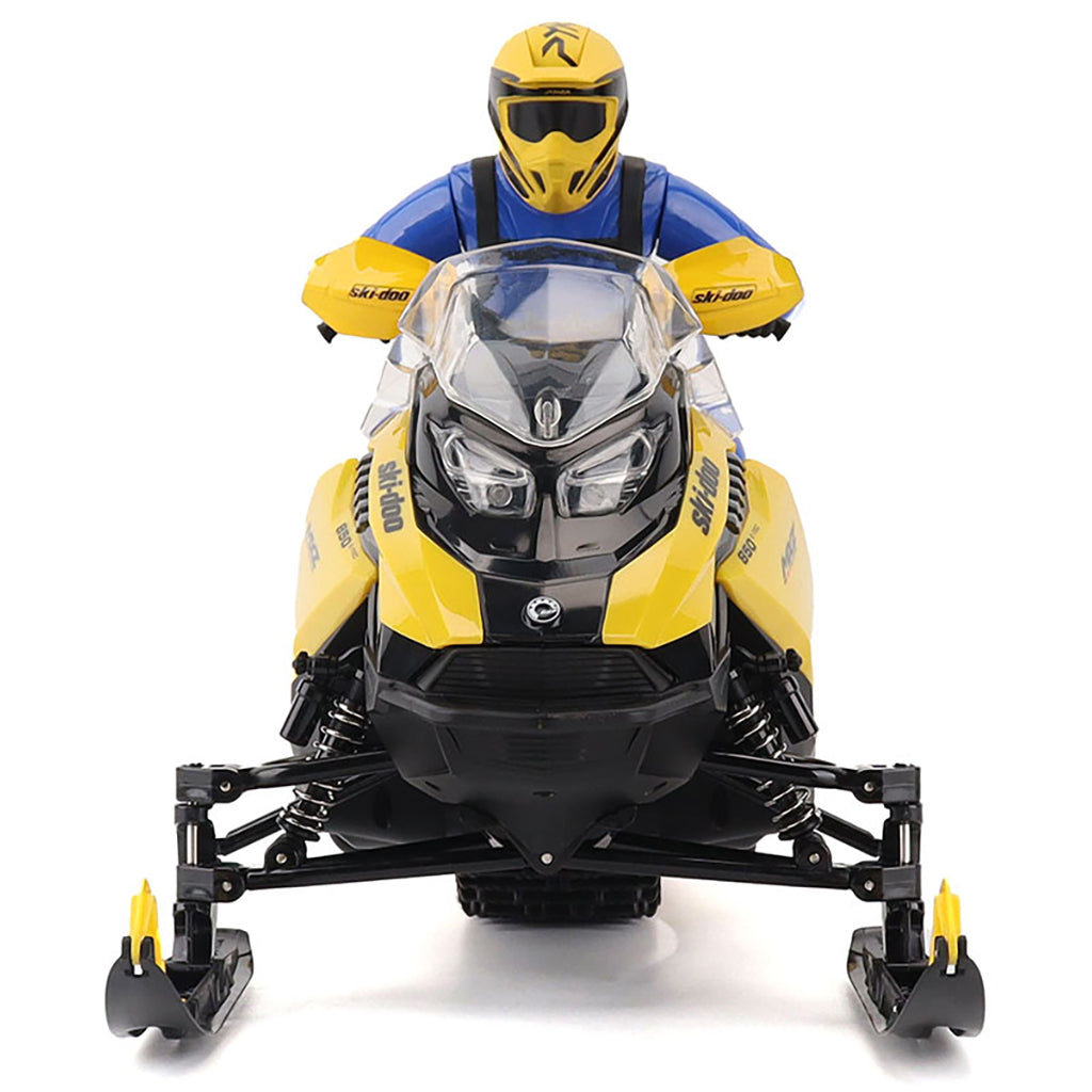 Model of a R/C Ski-Doo MXZ snowmobile with a rider on a white background