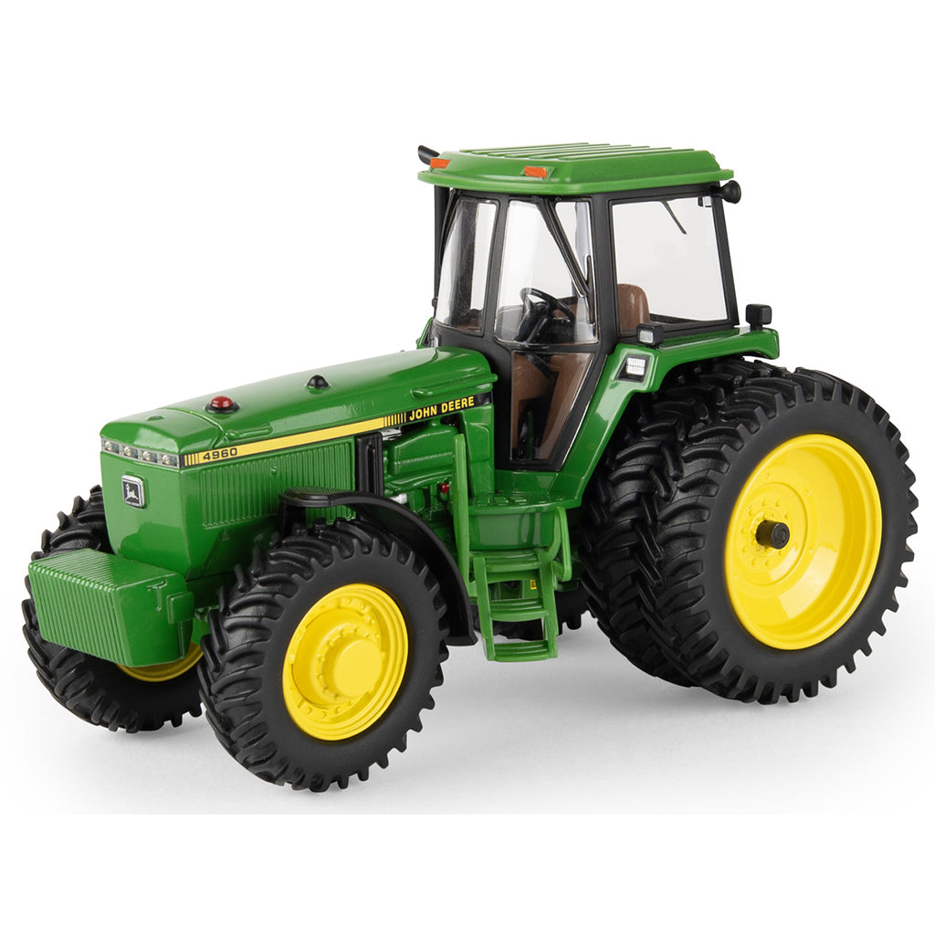 Model of a green John Deere 4960 tractor with yellow wheels on a white background