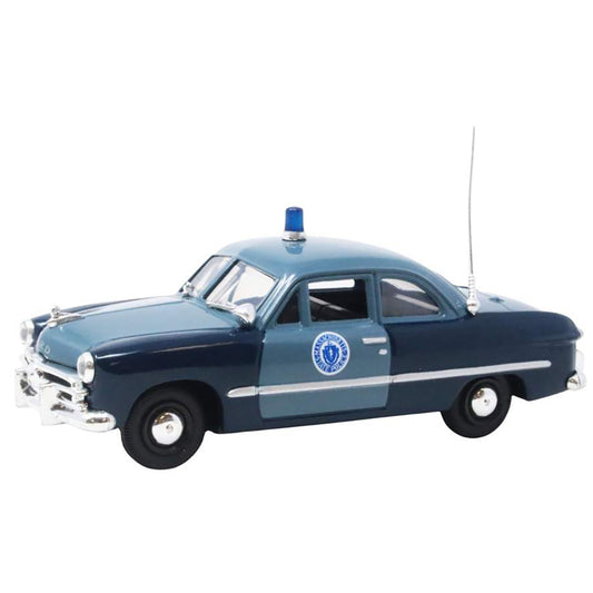 Model of a vintage police car on a white background