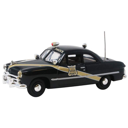 Model of a vintage police car on a white background