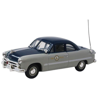 Model car with a blue roof and gray body on a white background