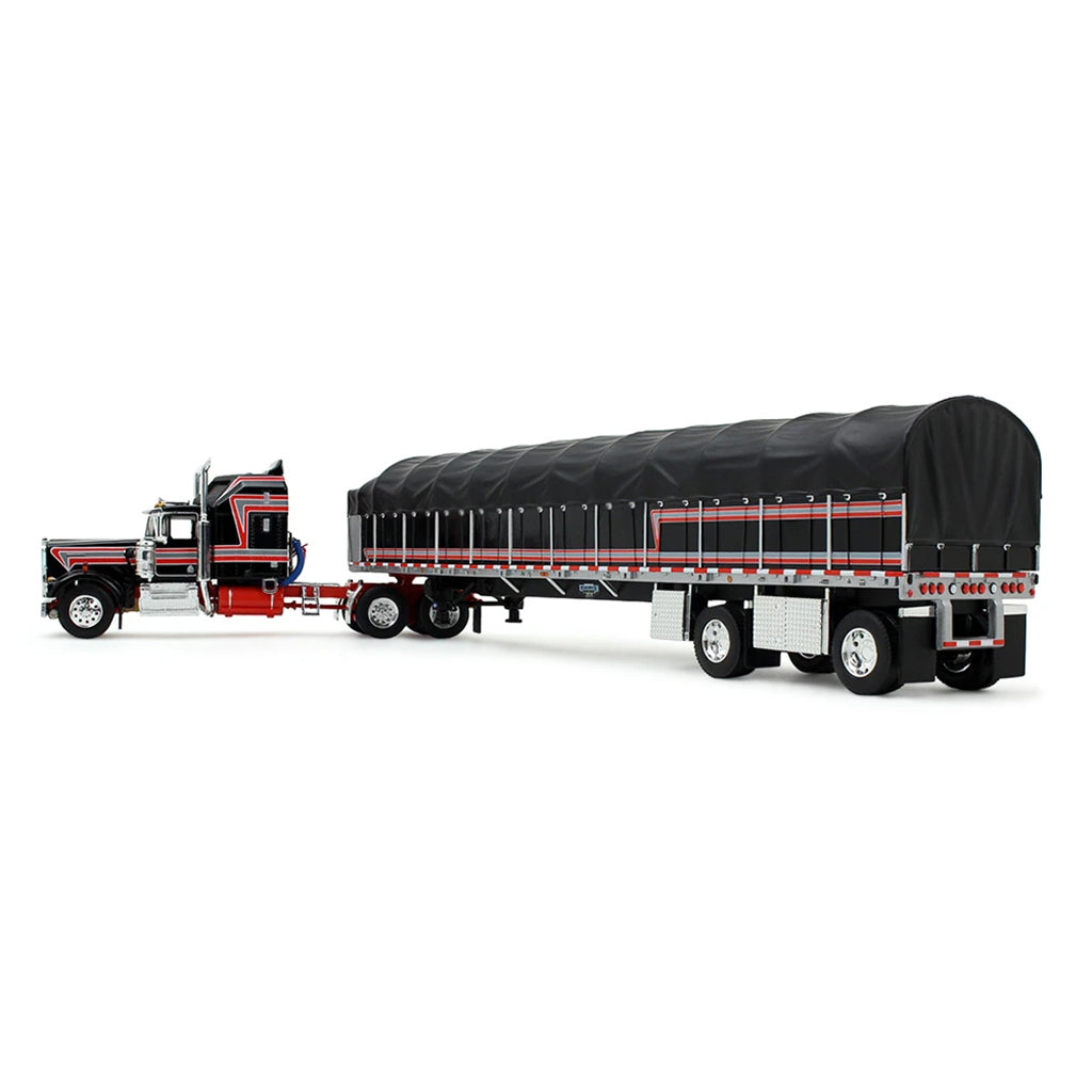 A die-cast model of a classic Kenworth semi-truck with a black and red cab, towing a long black canvas-covered trailer, shown on a plain white background.